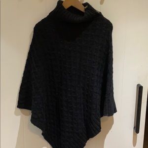 Cape knitted sweater